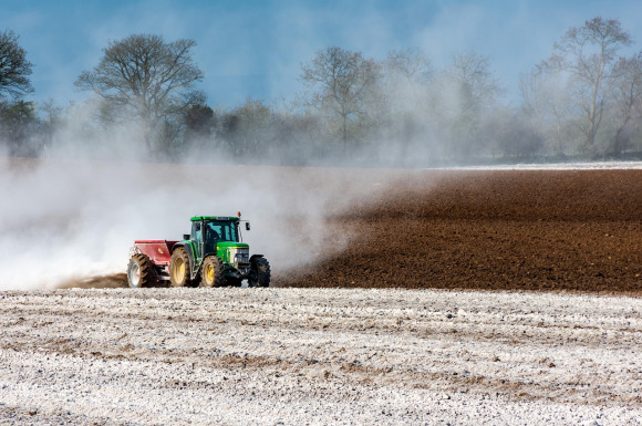 tractor working in a green field
